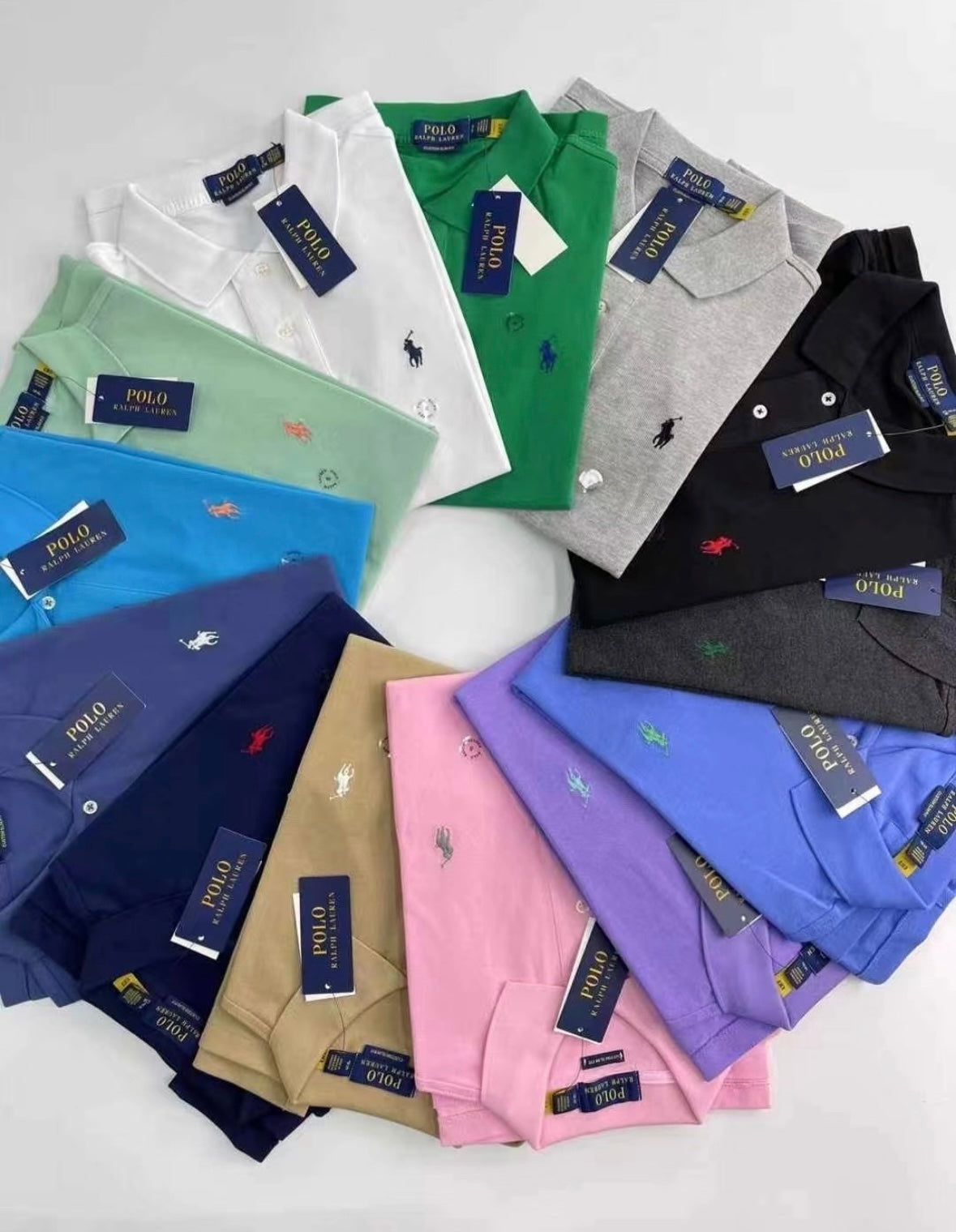 Collection of Polo Ralph Lauren shirts in various colors on a white background